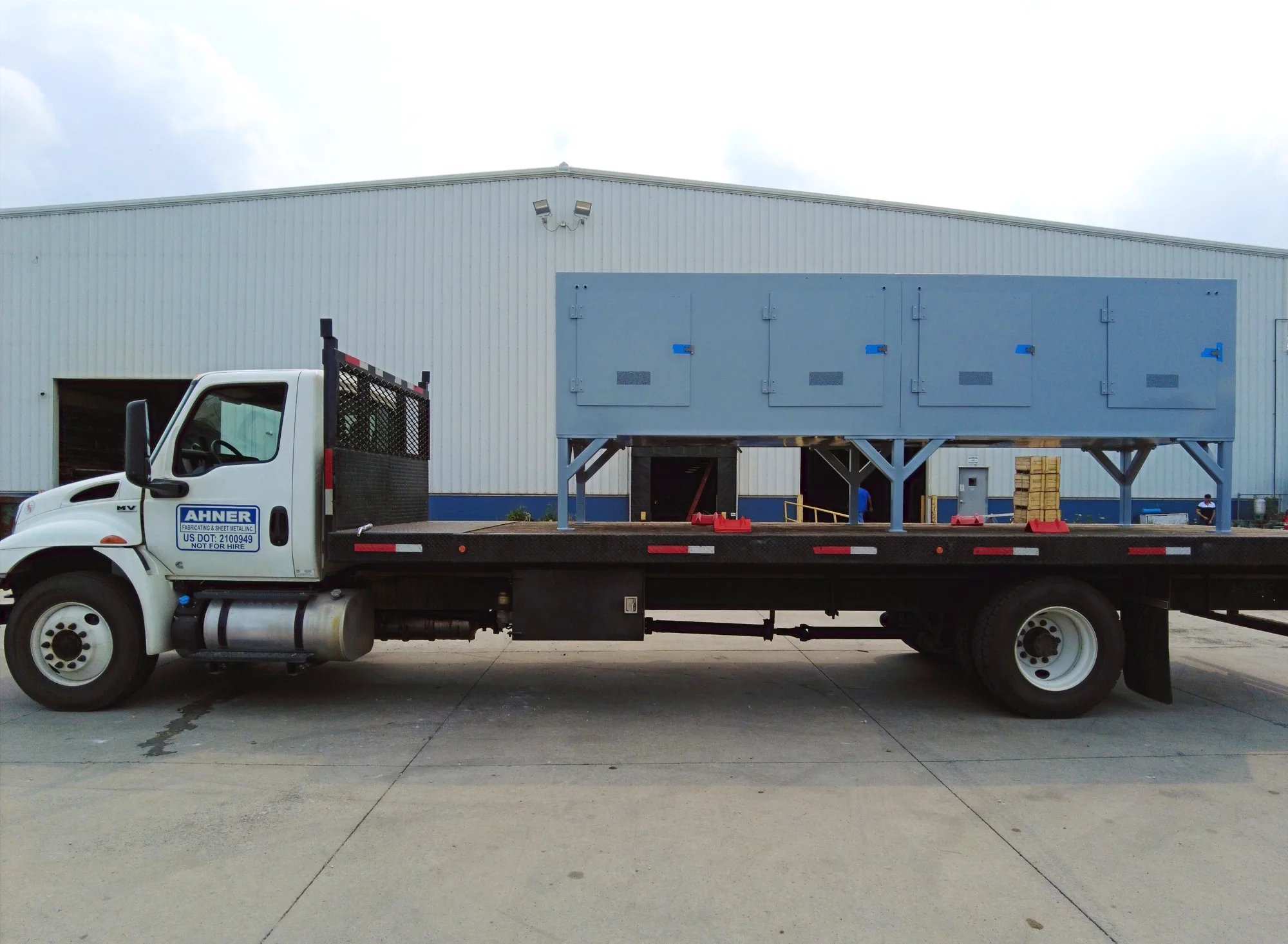Ahner truck carrying a completed fabricated assembly outside the shop